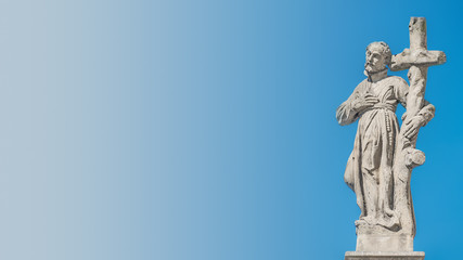 Decorative facade sculptures at Jesuit church of St. Ignatius of Loyola at Charles Square in Prague, Czech Republic, summer time, details, blue gradient background