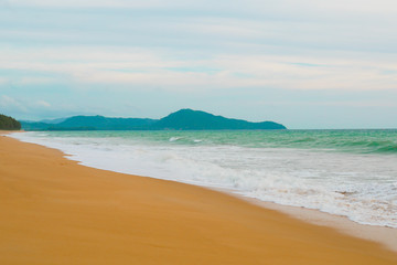 Beautiful beach ocean wave with blue color water of the sea background in daytime