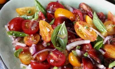 cherry tomato salad with basil and red onion, large sea salt and olive oil