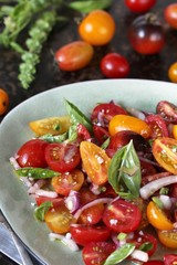 cherry tomato salad with basil and red onion, large sea salt and olive oil