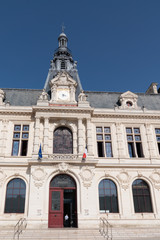 Fototapeta na wymiar poitiers details facade city hall in Place Marechal Leclerc Poitiers on blue sky