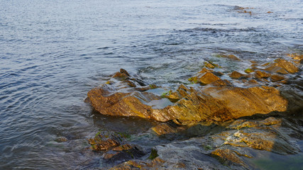 Sunlit rocks and the end of the day
