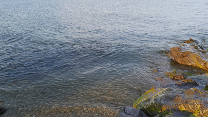 Sunlit rocks and the end of the day