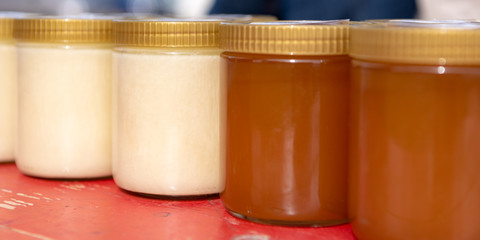 different varieties of bees  honey  bottled in small jars