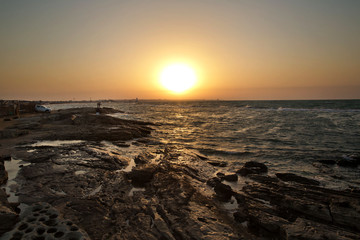 Nature composition.sunset beach ocean panorama . Coast beach in the Caspian Sea near Novxani at sunrise. Beautiful golden sunset over the beach. Colorful dawn over the sea. Azerbaijan