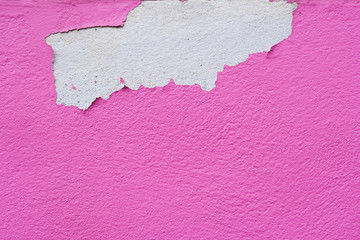 Pink abstract wall peeling paint background and wallpaper.