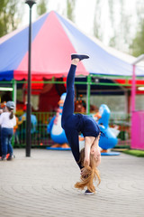 Girl gymnast, performs various gymnastic and fitness exercises