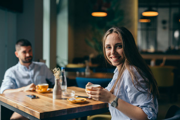 Conversations over some coffee. portrait of woman in cafeteria