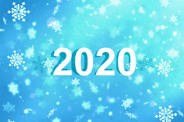 The inscription 2020 on a blue background with snowflakes. New year 2020. New year background, copy space.