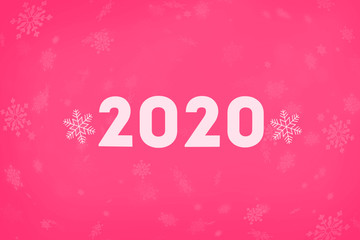 The inscription 2020 on a pink background with snowflakes. New year 2020. New year background, copy space.
