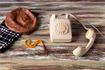 An old telephone on a wooden table