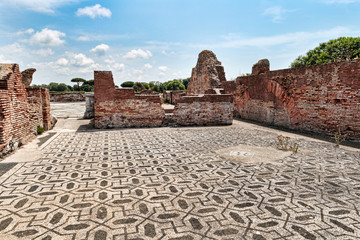 Panoramic view of ruin of Porta Marina thermal baths lobby in Ostia Antica with beautiful well preserved mosaic  - Roma