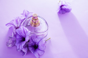 Bottle of perfume with flowers. Floral fragrance. Organic cosmetics