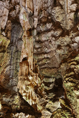 Stalactites and flow stones in a marble cave