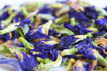 Anchan. Blue tea. Dried flowers of clitoria are ternate. Close-up. Background. Texture.