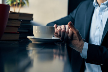 businessman working on laptop in cafe