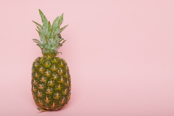 Half cut juicy pineapple on a pastel pink background. Minimal su