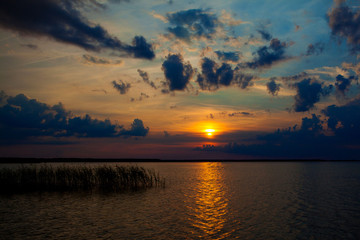 Beautiful summer sunset in the lake Svityaz. Sunset Background