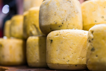 Selection of traditional Italian cheeses on a display, selective focus