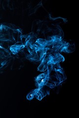 Fototapeta premium Light Blue Smoke on the Black Background