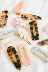 Group of Acrylic and Pearl Hair Clips on White Linen Background, Women's Modern Hair Accessories,...