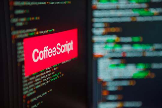 Programming language, CoffeeScript inscription on the background of computer code.