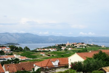 A view an old croatian village and sprawling wine vineyard growing the local grk grapes with the...