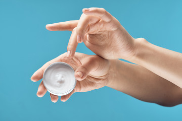 hands holding a ball isolated on white background