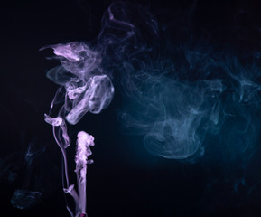 Fototapeta premium Abstract colorful smoke on black background .
