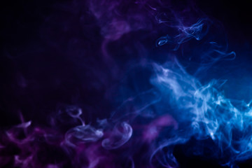 Fototapeta na wymiar Abstract colorful smoke on black background .