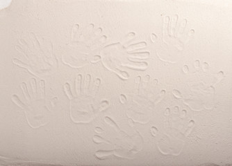 traces of hands on the sand