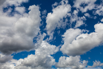 Blue summer sky in gorgeous white clouds.