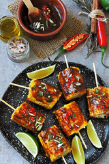 Corn on sticks with chili lime sauce. Vegan food. Eco food.