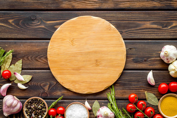 Cutting board in frame of food for chef work on wooden background top view space for text