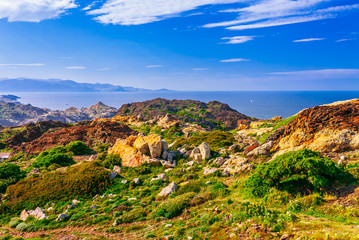 Sea landscape with Cap de Creus, natural park. Eastern point of Spain, Girona province, Catalonia. Famous tourist destination in Costa Brava. Sunny summer day with blue sky and clouds