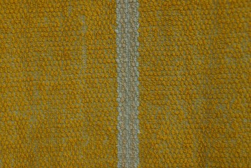 yellow fabric texture from a piece of cloth with a gray stripe