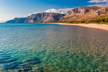 Panoramic sea beach landscape near Gaeta, Lazio, Italy. Nice sand beach and clear blue water. Famous tourist destination in Riviera de Ulisse. Bright sunny light and sunset.