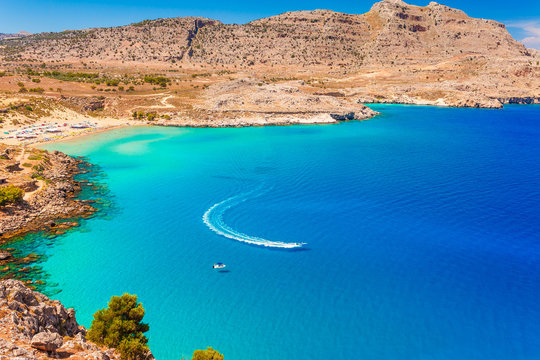 Sea skyview landscape photo of Agia Agathi beach near Feraklos castle on Rhodes island, Dodecanese, Greece. Panorama with sand beach and clear blue water. Famous tourist destination in South Europe