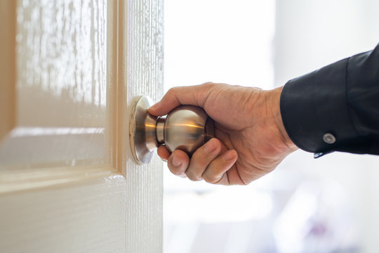 Man Hand Holding Door Knob