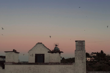 view of alberobello at sunset. Roof stones trulli of Alberobello. Puglia, southern Italy