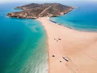 Aerial birds eye view drone photo Prasonisi on Rhodes island, Dodecanese, Greece. Panorama with nice lagoon, sand beach and clear blue water. Famous tourist destination in South Europe - obrazy, fototapety, plakaty
