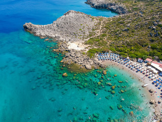 Naklejka na ściany i meble Aerial birds eye view drone photo Ladiko bay near Anthony Quinn on Rhodes island, Dodecanese, Greece. Panorama with nice lagoon and clear blue water. Famous tourist destination in South Europe