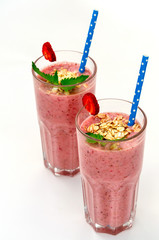 Banana strawberry breakfast with oat in a jar on white background