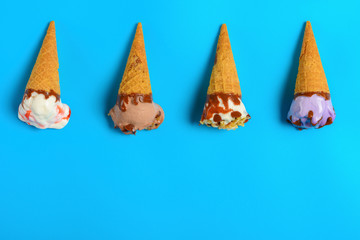 mini ice cream cones start melting on a blue background