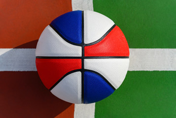 basketball ball on the guide lines of an outdoor stadium symmetric composition