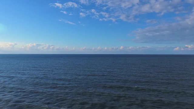 BEAUTIFUL BLUE SEA AND CLOUDY SKY FROM THE AIR