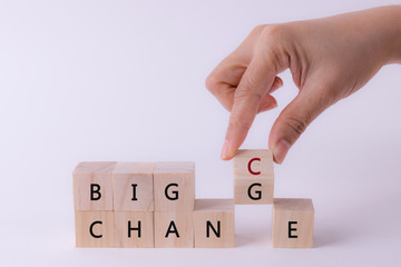 Woman hand flip wooden cube with word change to chance, Personal development or change yourself concept.