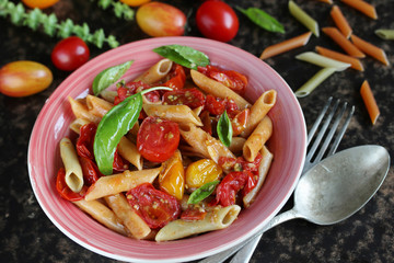  Penne pasta with  cherry tomatoes confit. multicolored cherry