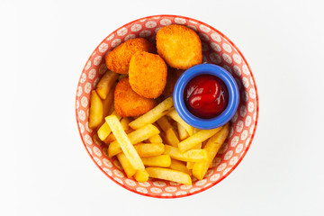 Kids menu: french fries with ketchup and deep fried crispy chicken nuggets isolated on whute bacjground