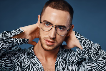 portrait of young man in glasses